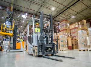 Forklift operator UDT at an electrical equipment warehouse