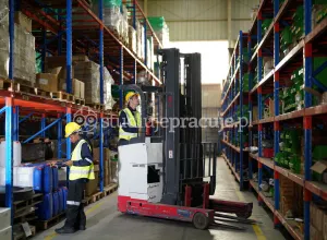 Forklift operator in a warehouse with UDT certification